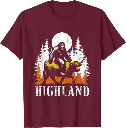 Bigfoot Riding Highland Cow - Funny Sasquatch Cow Lover T-Shirt - T-Shirt | Maroon
