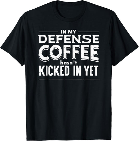 Funny Saying In My Defense Coffee Hasn't Kicked In Yet T-Shirt - T-Shirt | Black